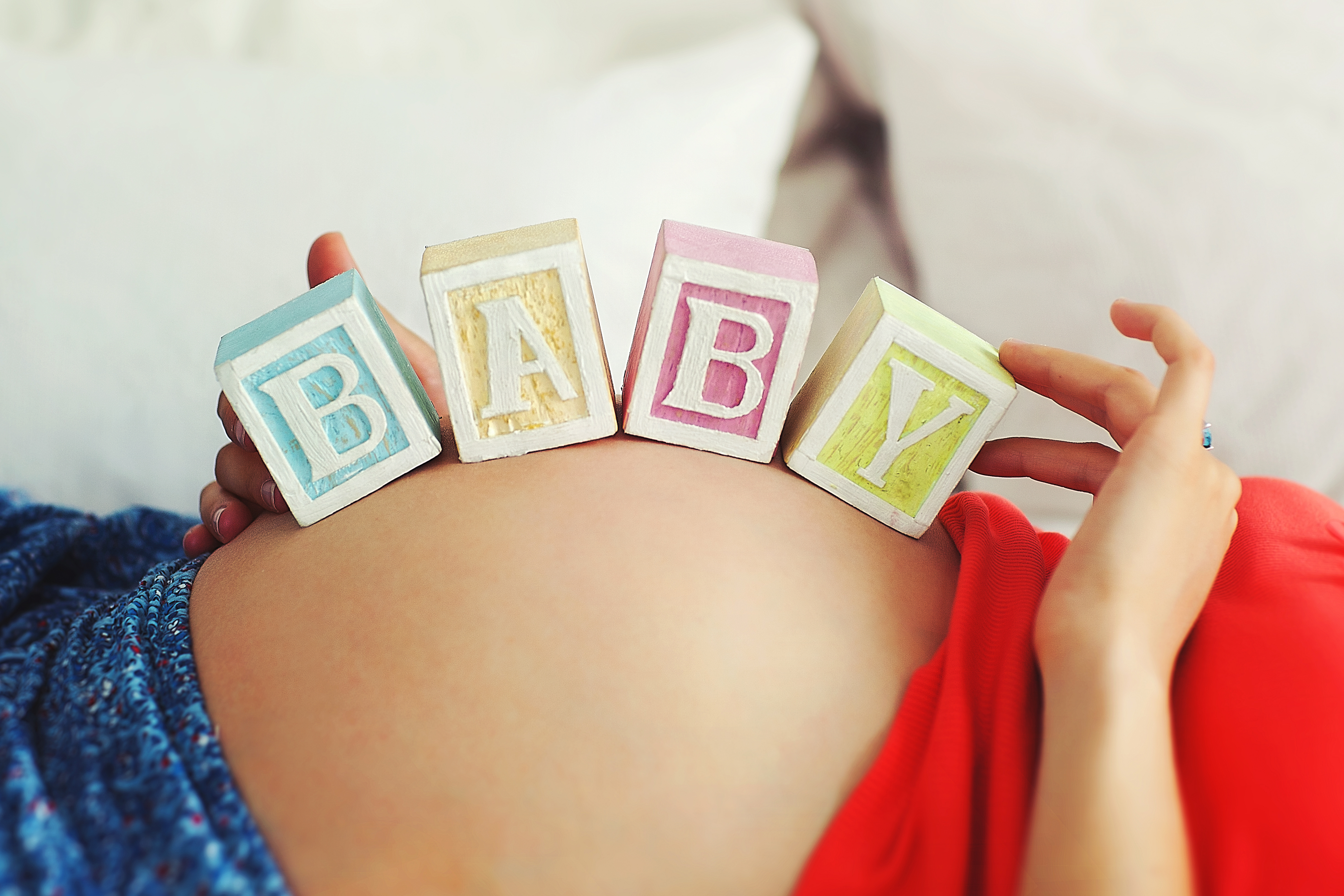 pregnant woman marveling at pregnancy