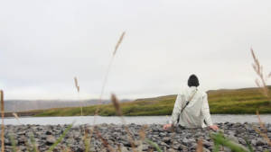 man sitting on the shore